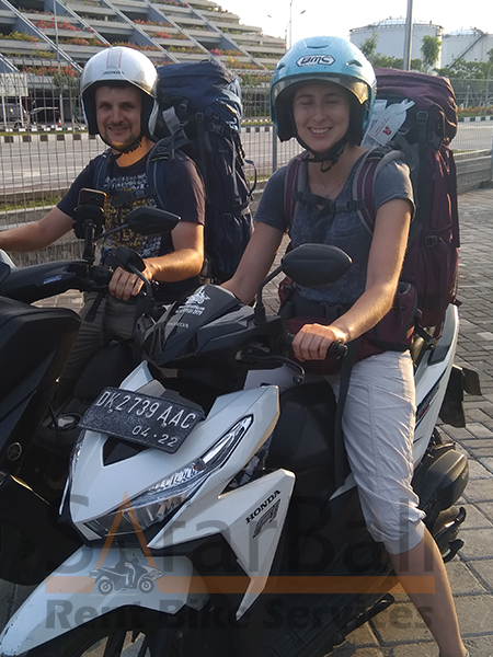 Safar Bali Rent Bike - Couple Clients 2 Tourist couple riding a rented scooter in Bali-Safar Bali Rent Bike scooter hire.